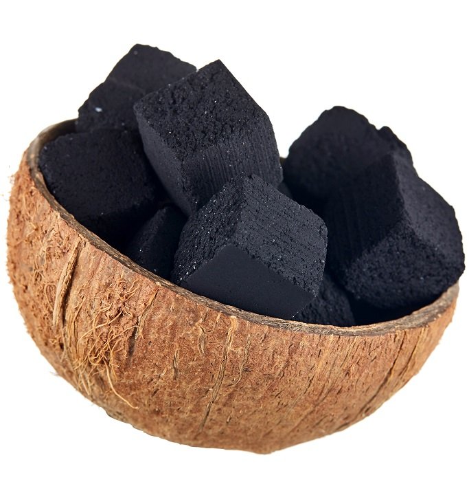 Coconut charcoal on a white background. Coconut coal cubes for hookah close-up.